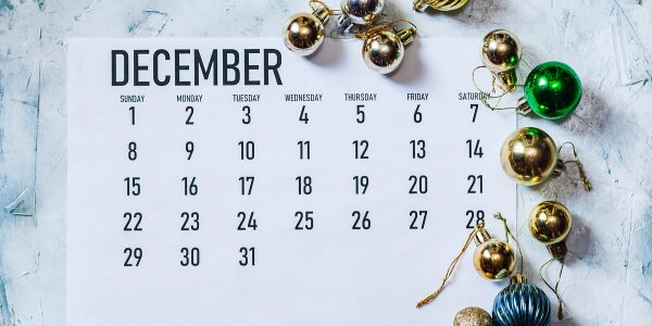 Lauth Investigations International | What To Know About End of Year Tax Implications and Asset Location? december 2024 calendar surrounded by Christmas tree decorations