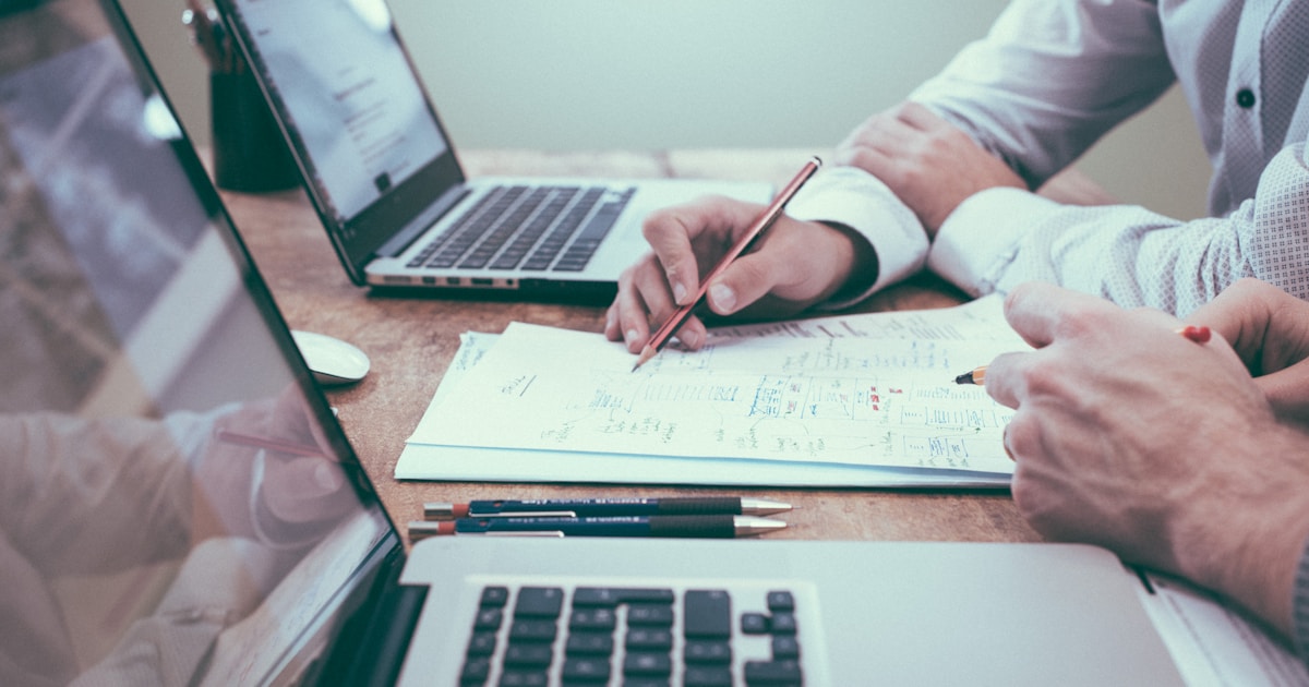 Workers compensation fraud investigation - employer reviewing suspicious claim documents